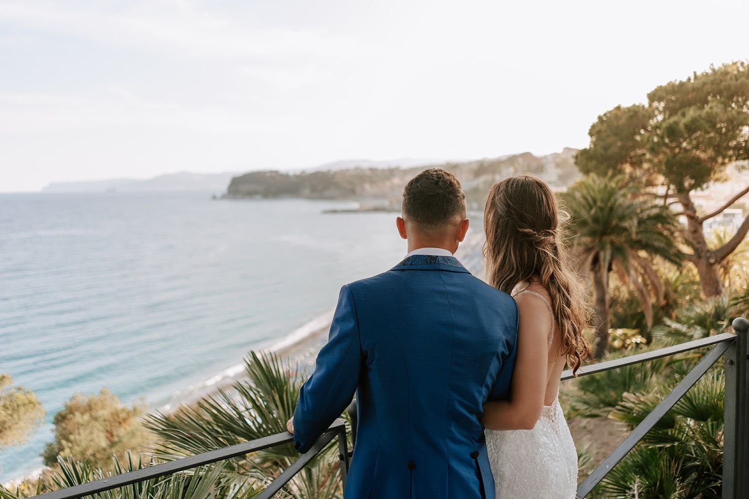 The newlyweds enjoy the sea view at Villa Lagorio, a wedding venue in Celle Ligure, in the province of Savona.