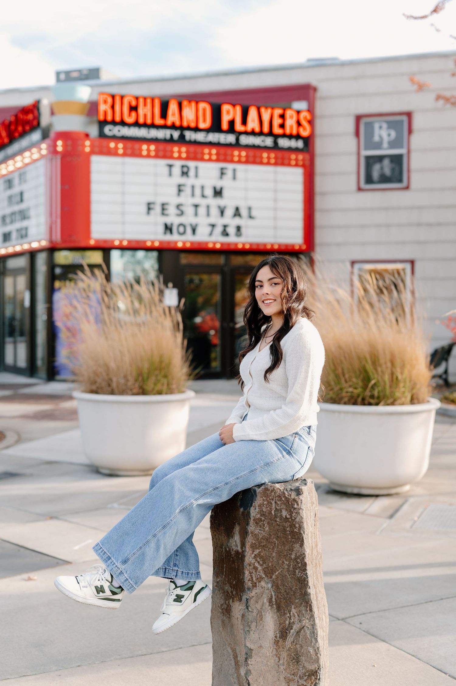 Downtown senior pictures in front of an old theater in Richland, WA