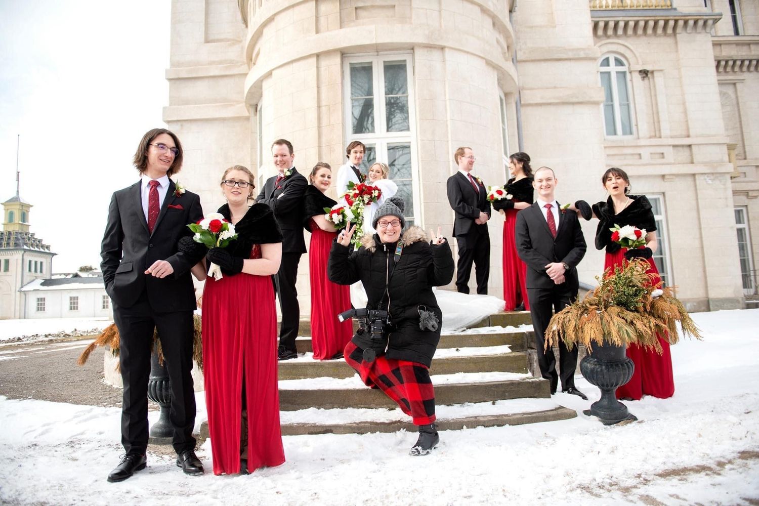 Photo of Jacquie (owner of Simply Wedding Events) with a wedding party having fun.