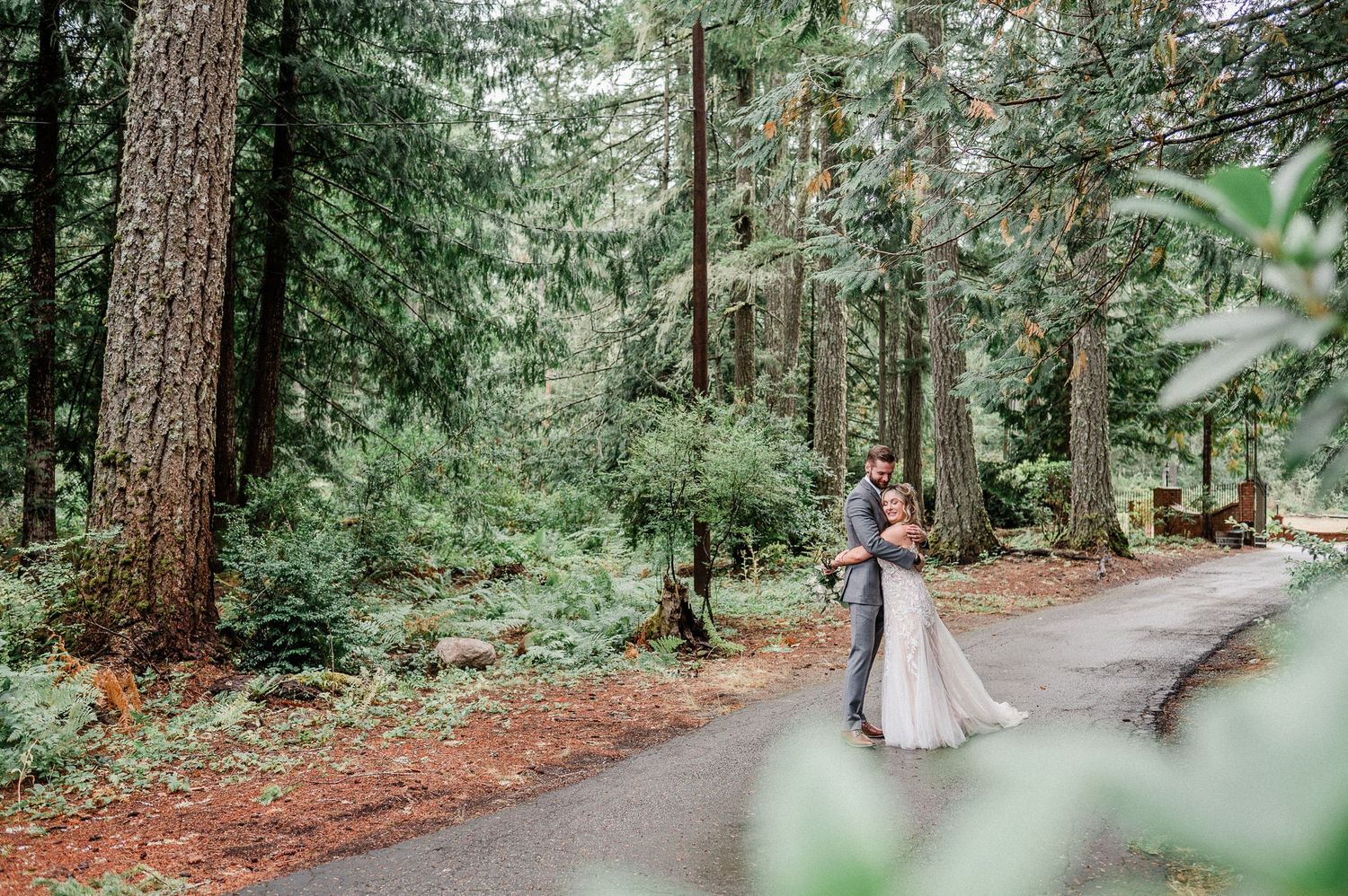 couple kissing amongst forest setting