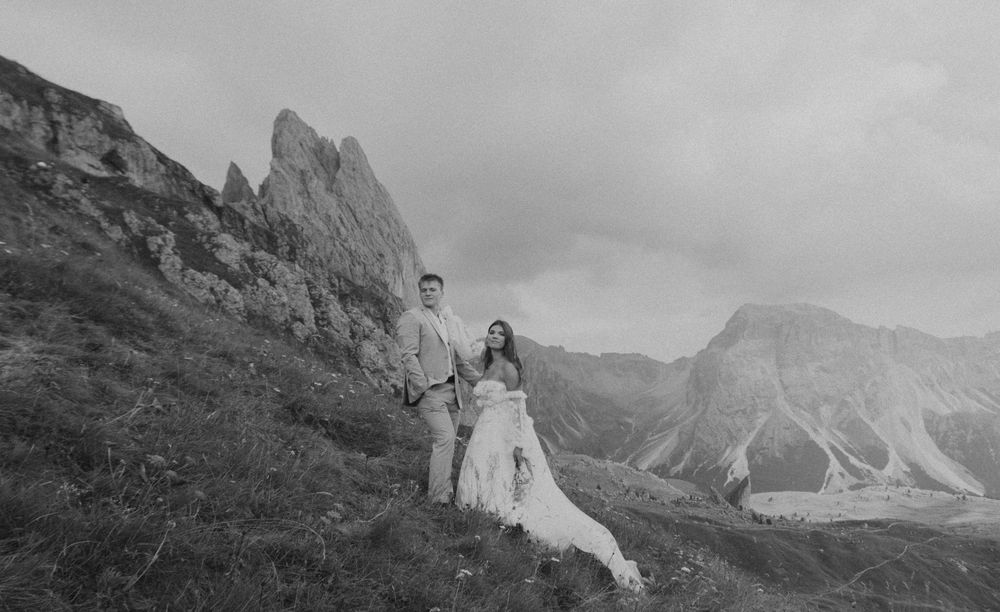 A series of black and white mountain landscape photographs showing dramatic peaks and valleys in rugged terrain.