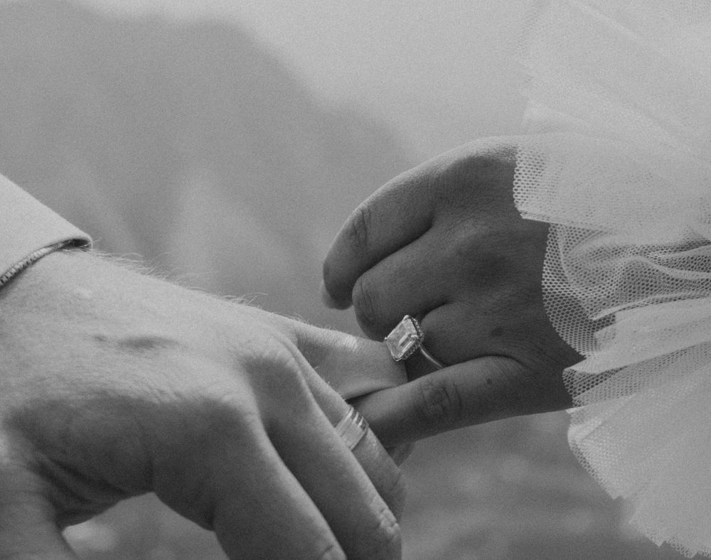 A close-up black and white photo series showing hands performing various medical procedures and examinations.