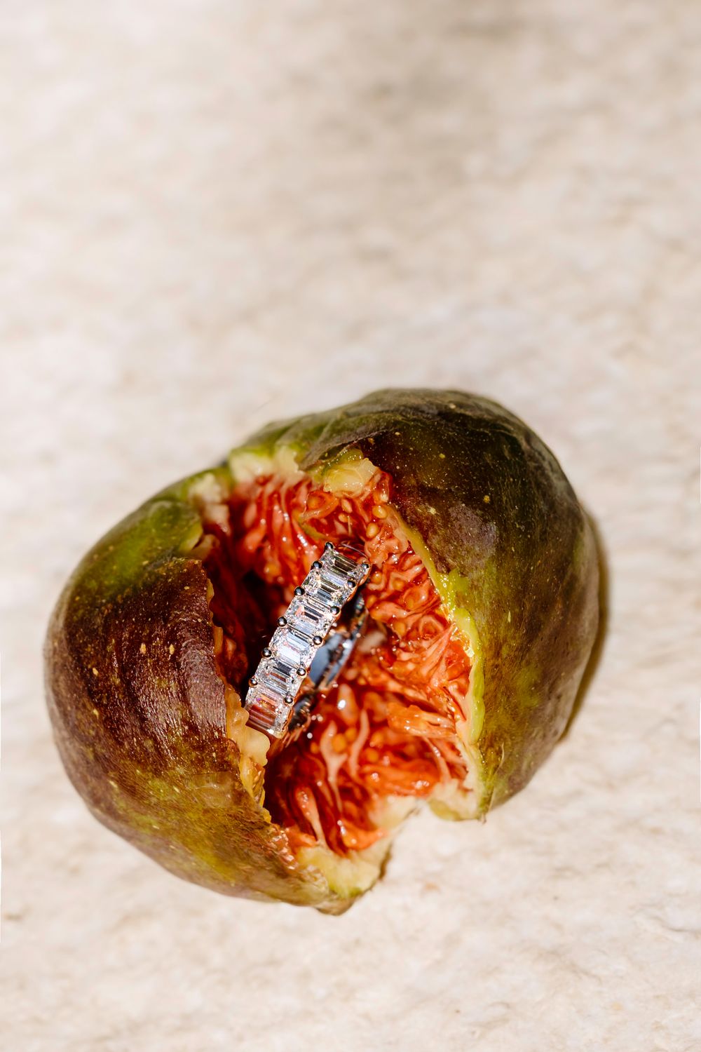 A sequence of four photos showing a cut avocado with orange-colored rot or mold growing inside on a light surface.