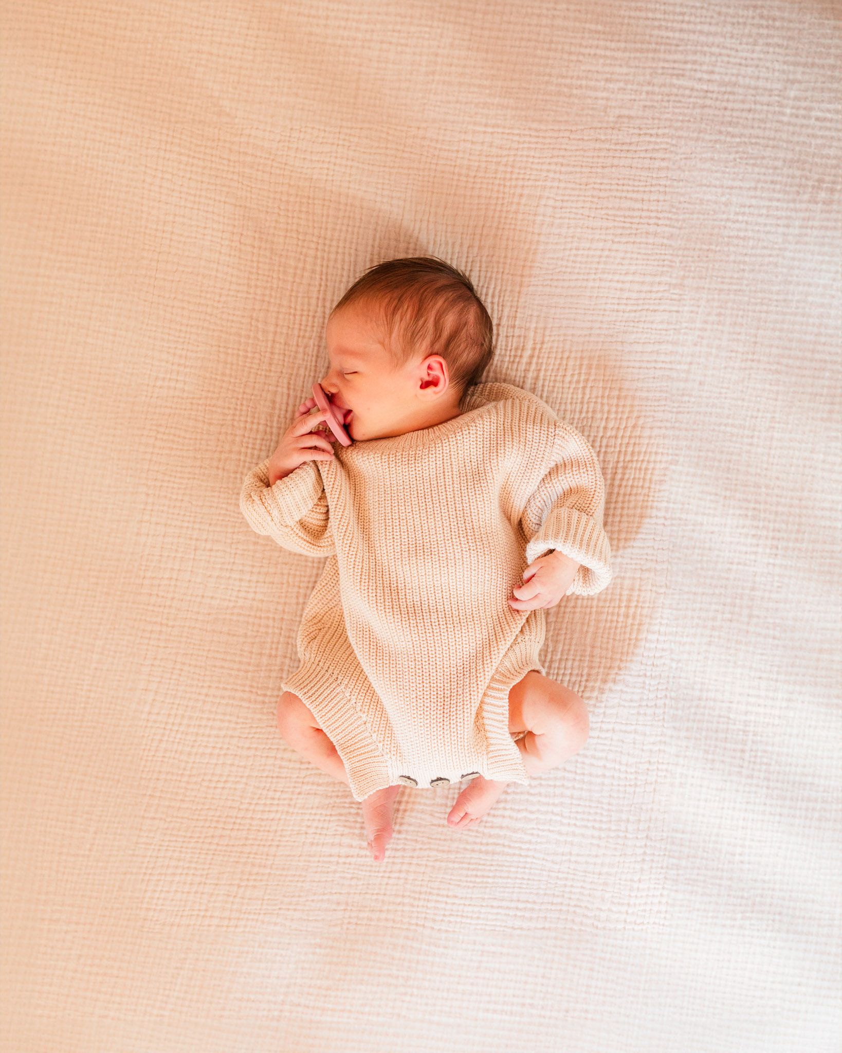 Richmond, Virginia newborn photographer documents tiny baby sleeping in her crib.
