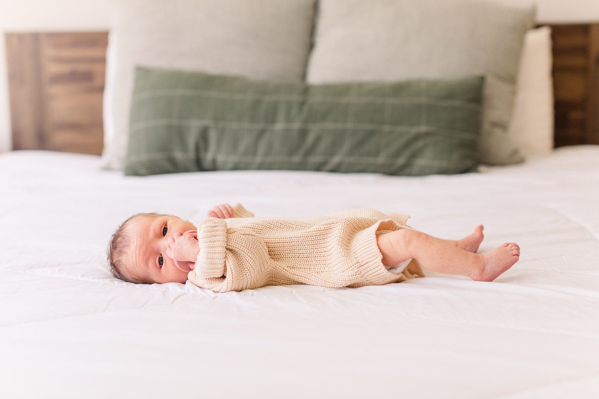 Richmond Virginia newborn photographer documents details of new baby laying on bed.