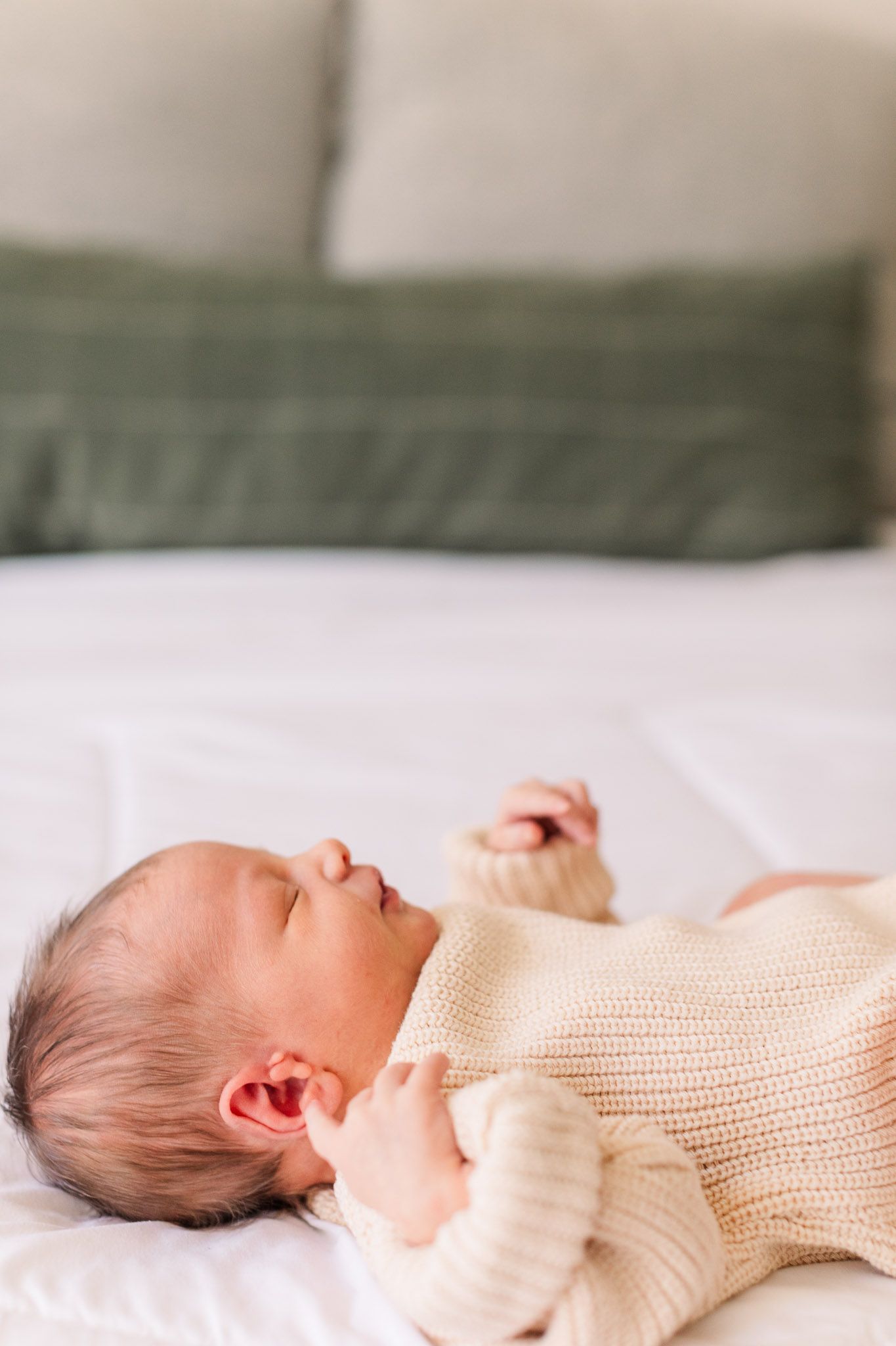 Richmond Virginia newborn photographer documents details of new baby laying on bed.