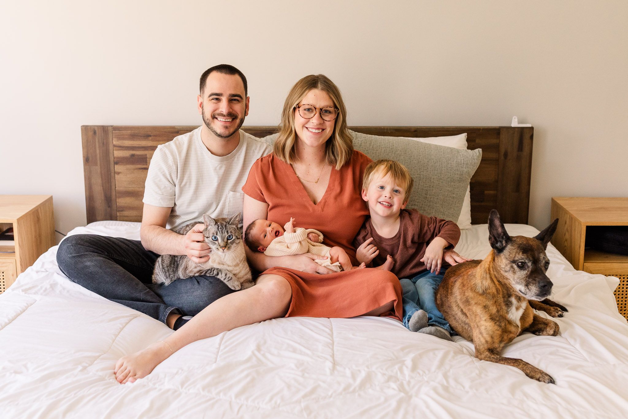 Richmond Virginia family photographer photographs a mom, dad, toddler, newborn baby, cat, and dog family portrait.