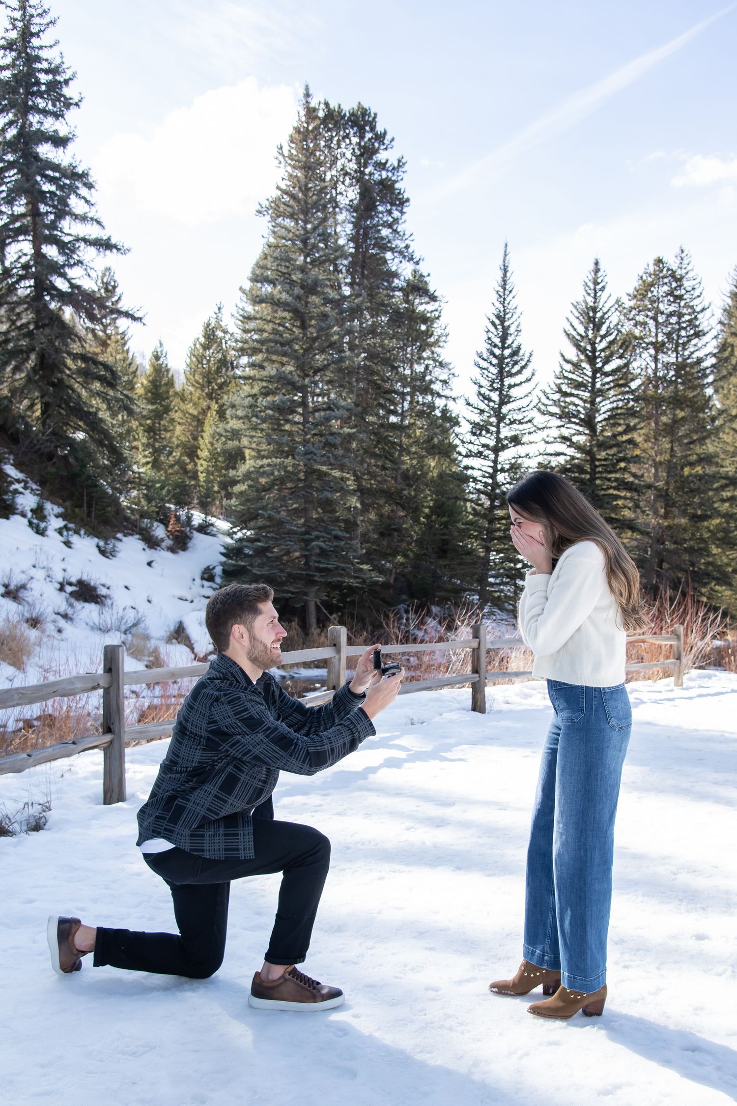 Beautiful scenic winter proposal with a cute stylish couple in Vail Colorado.