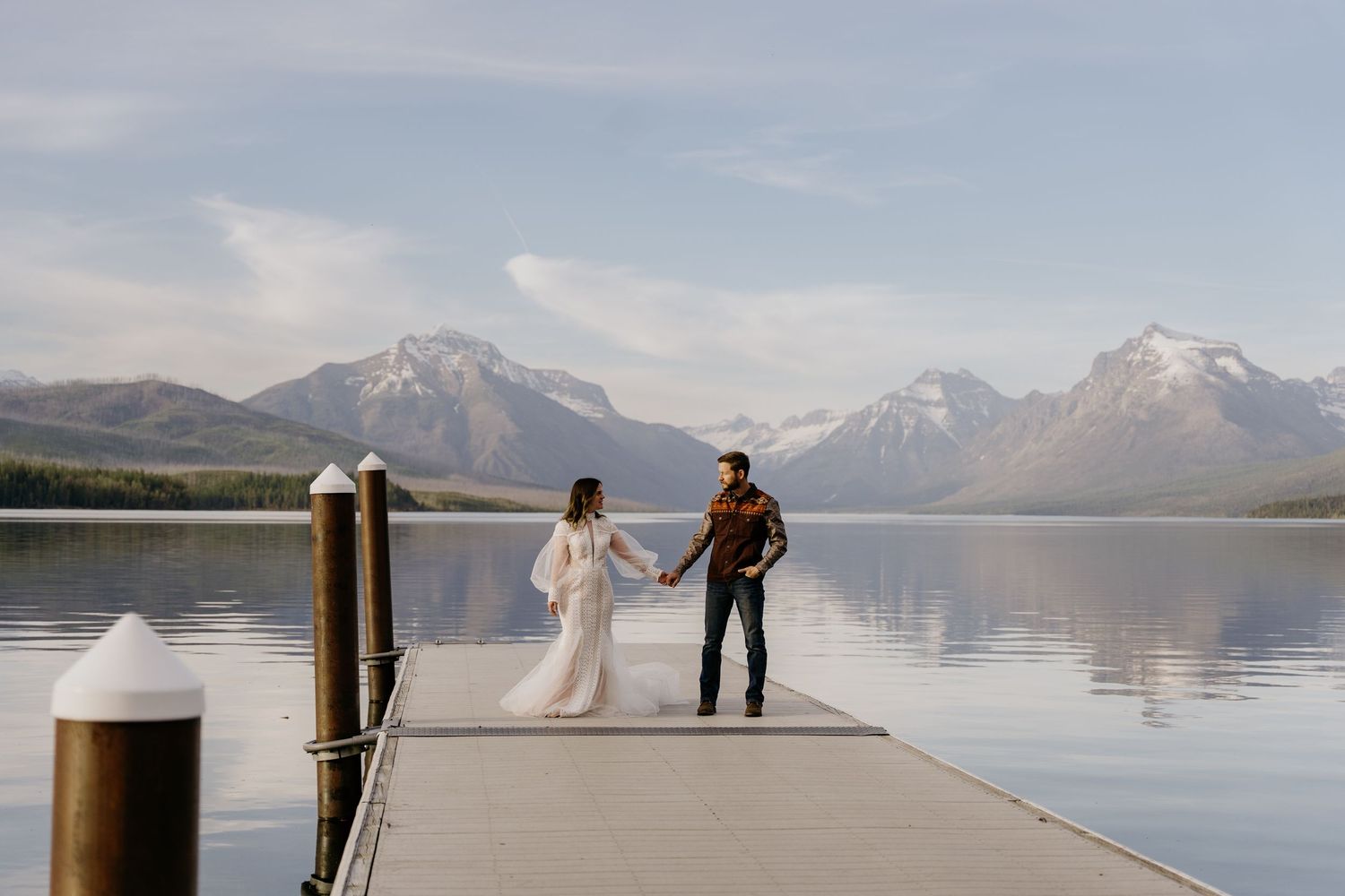 Scenic mountain lake view with snow-capped peaks and calm waters.