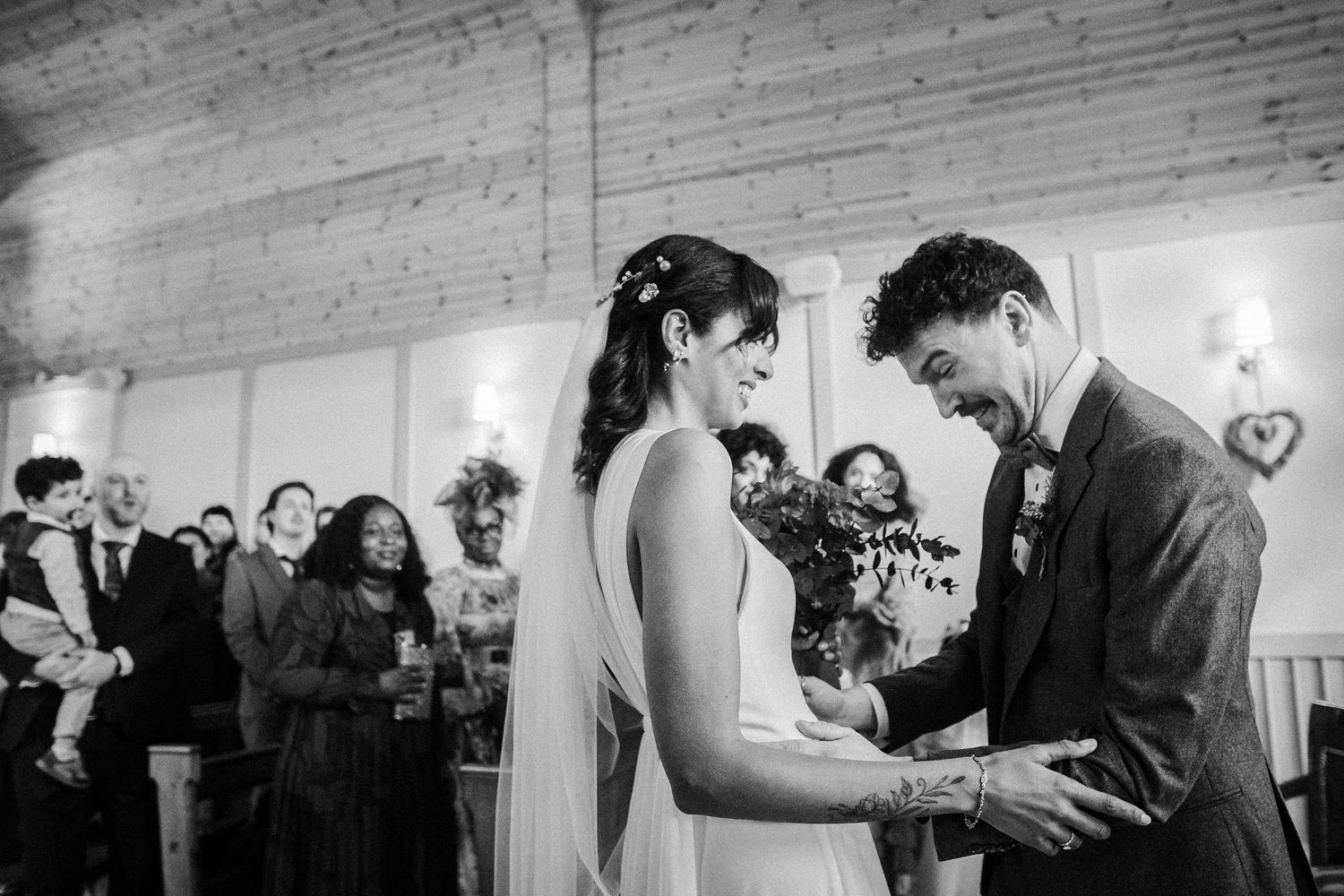Black and white wedding photos showing a couple's special moments during their ceremony and reception.