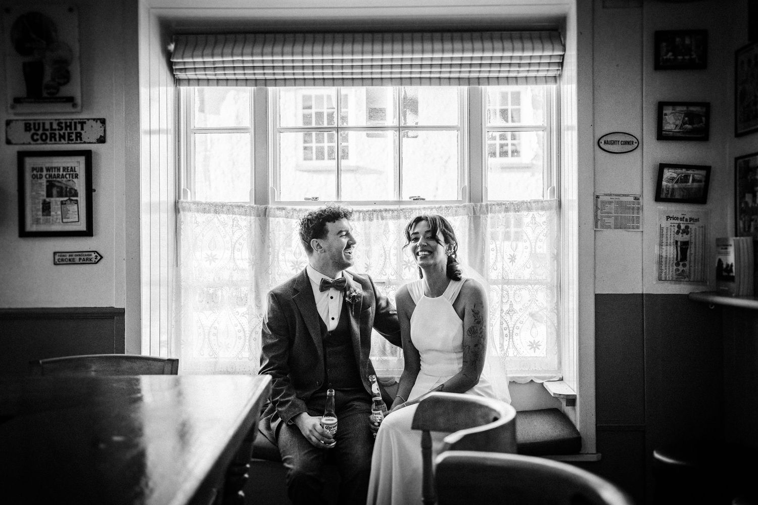 Black and white photo series showing intimate moments between a couple in a sunlit apartment interior.