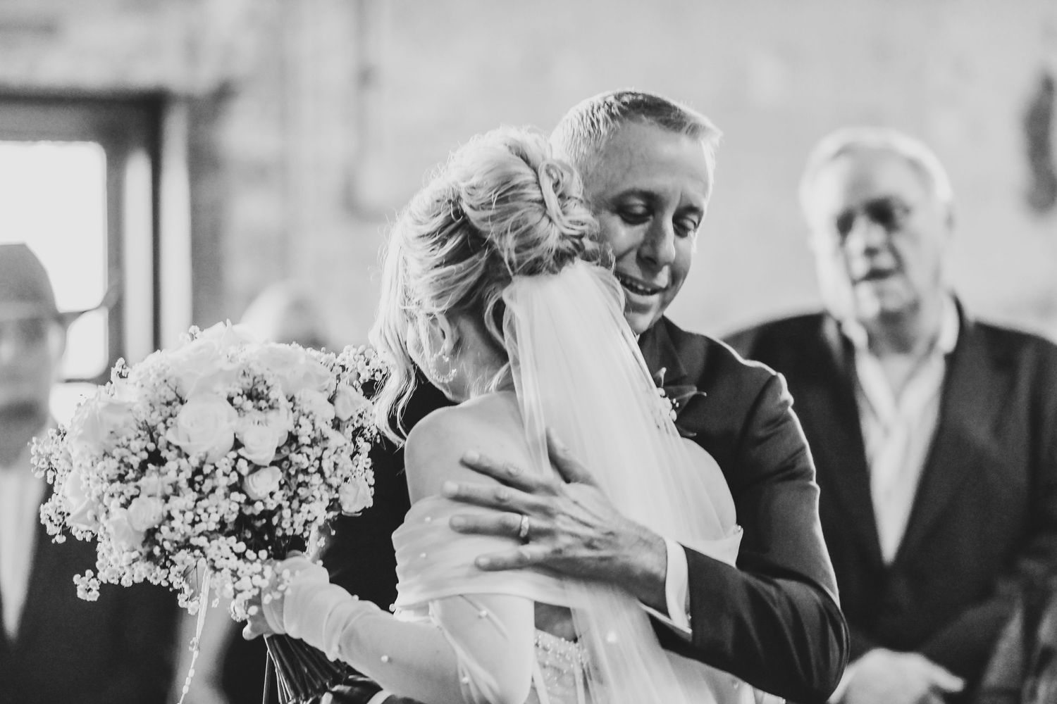 Bride walking down the aisle with her father during elegant Christian wedding ceremony