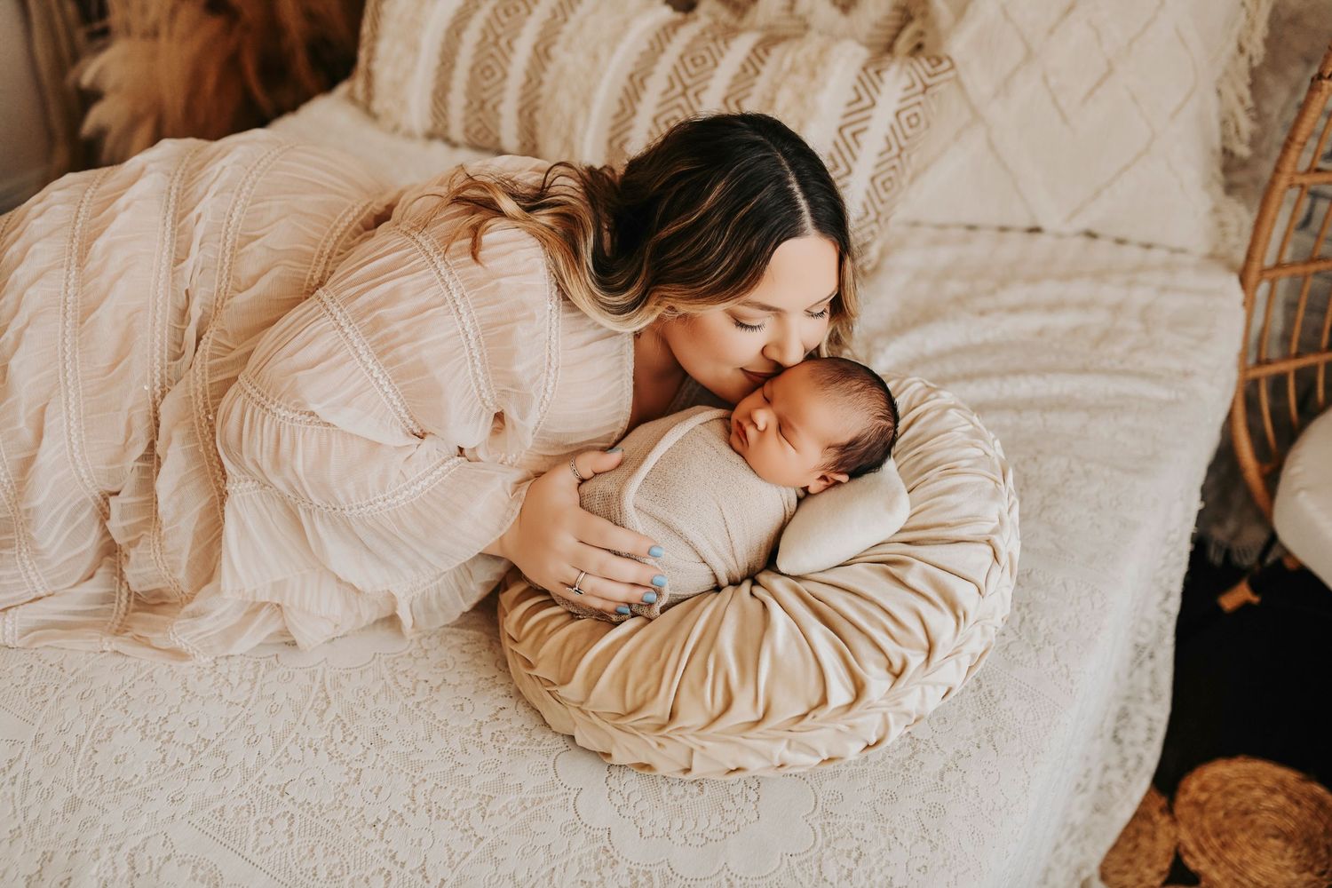 New mom cradling her baby during newborn session
