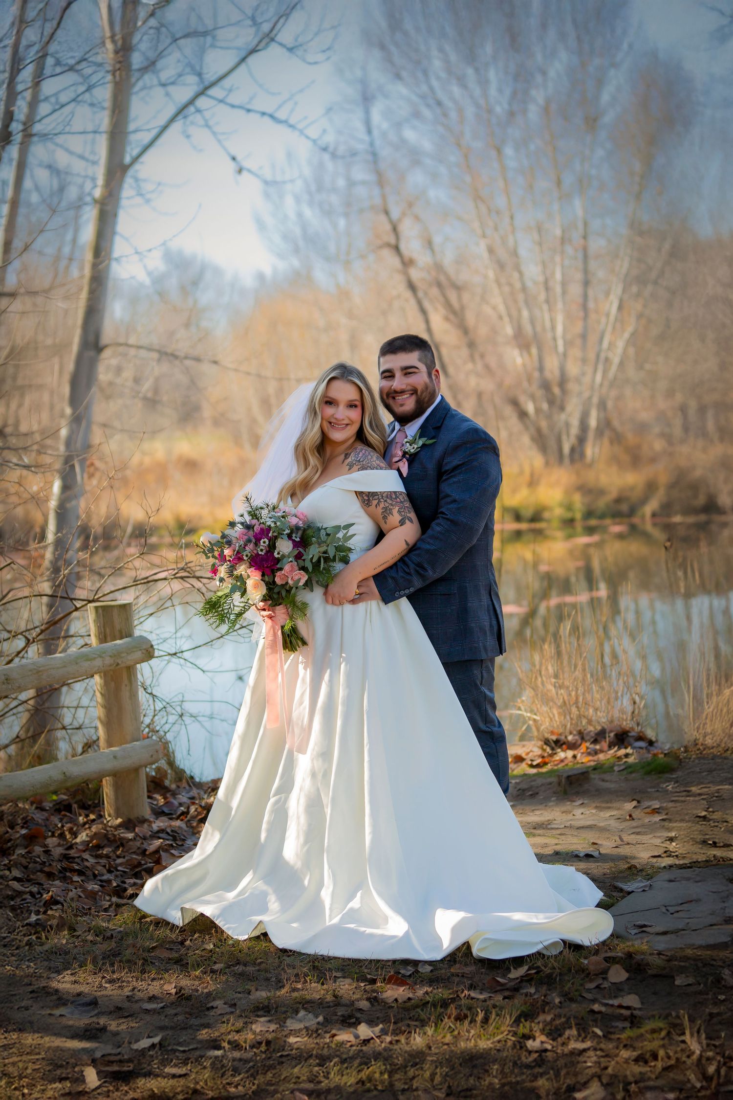 Bride and Groom Portrait in Eagle Idaho near water and autumn foliage