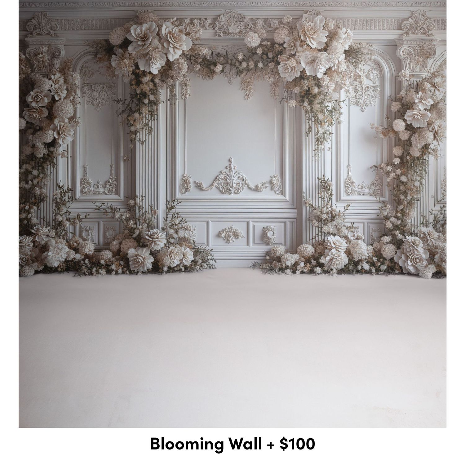 Elegant white wall decorated with ornate moldings and lush floral arrangements in soft neutral tones creates a romantic backdrop.