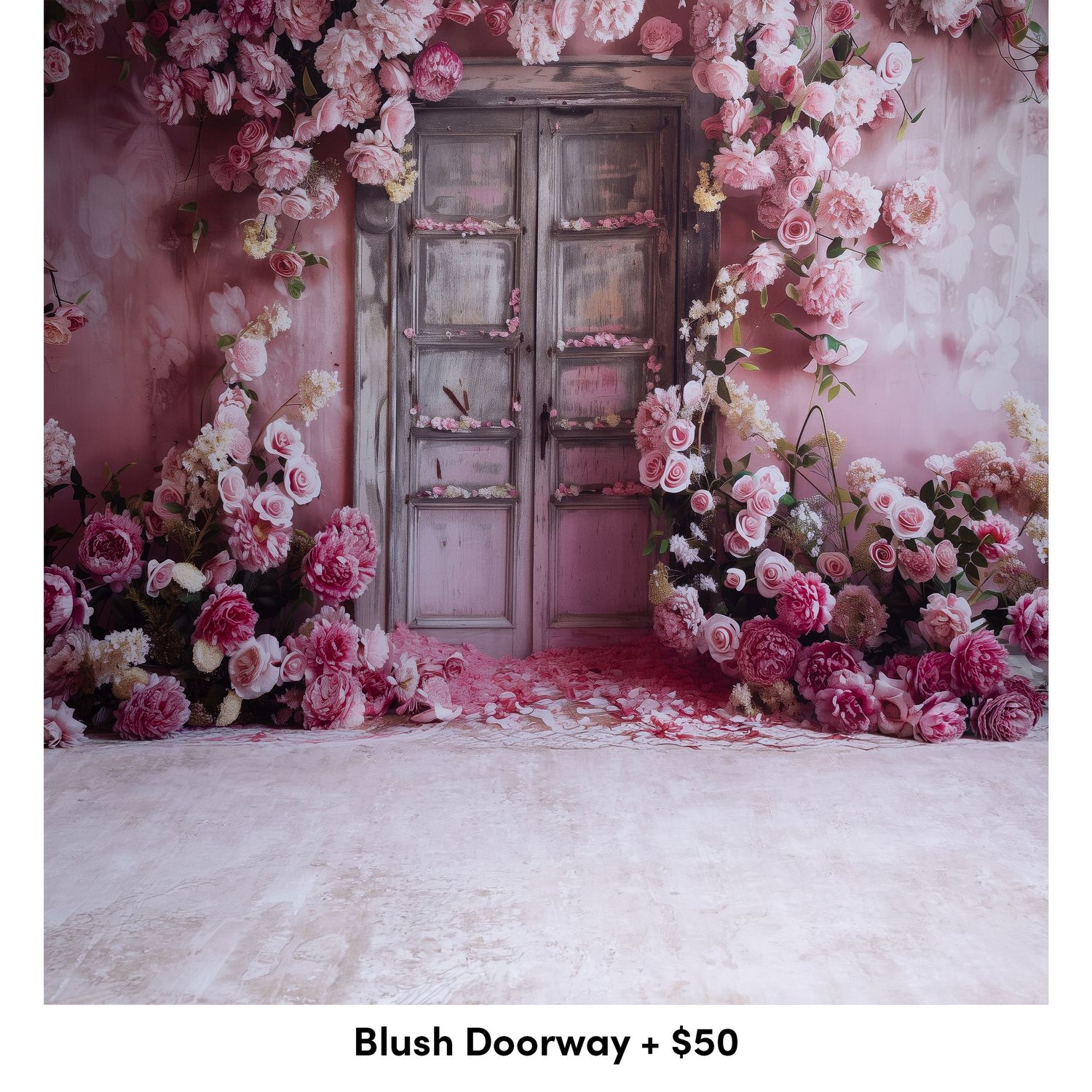 Romantic pink floral backdrop with vintage wooden door and scattered rose petals creating a dreamy wedding scene.