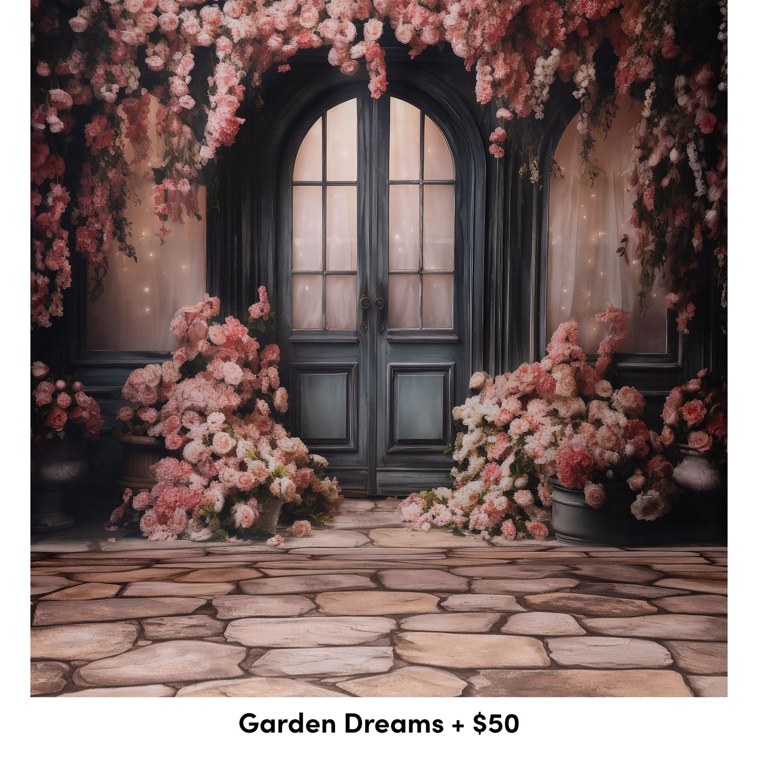 Vintage black doors surrounded by lush pink roses and stone flooring create a romantic garden entrance setting.