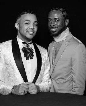 Black and white portraits of men in formal wear smiling and posing together.