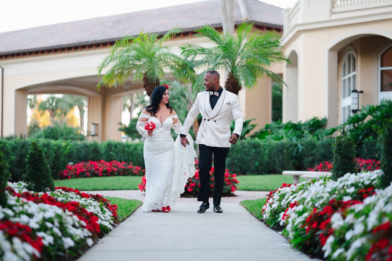 Treasure Coast Wedding Photographers captured this intimate moment with this bride and groom strolling through a garden.