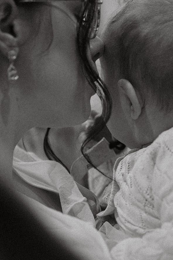 A series of black and white close-up photos showing two people kissing in a romantic moment.