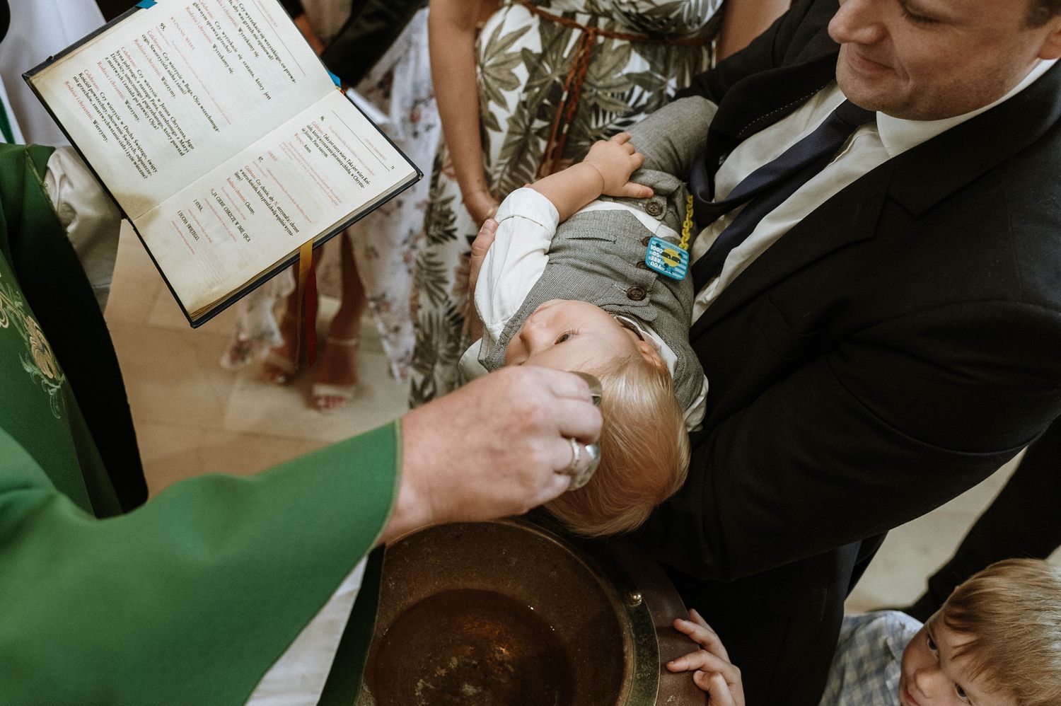 Close-up view of hands holding and signing paperwork during a business meeting or contract signing.