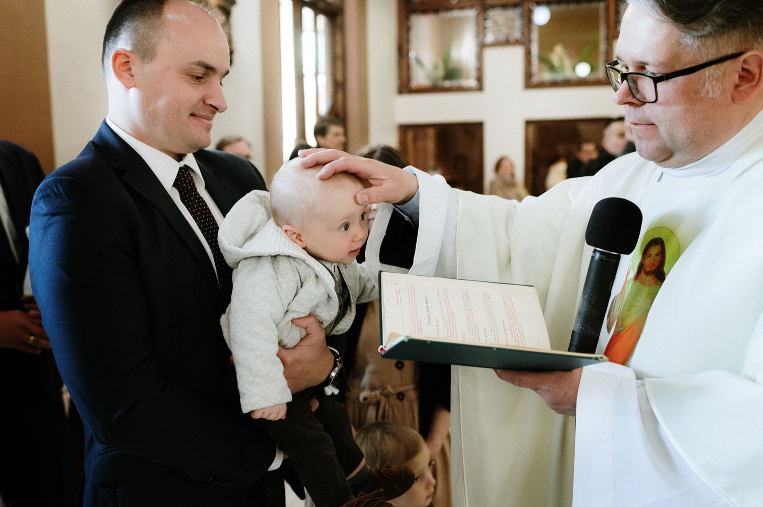 A series of photos showing a chef helping someone put on a formal white chef's coat in a restaurant setting.