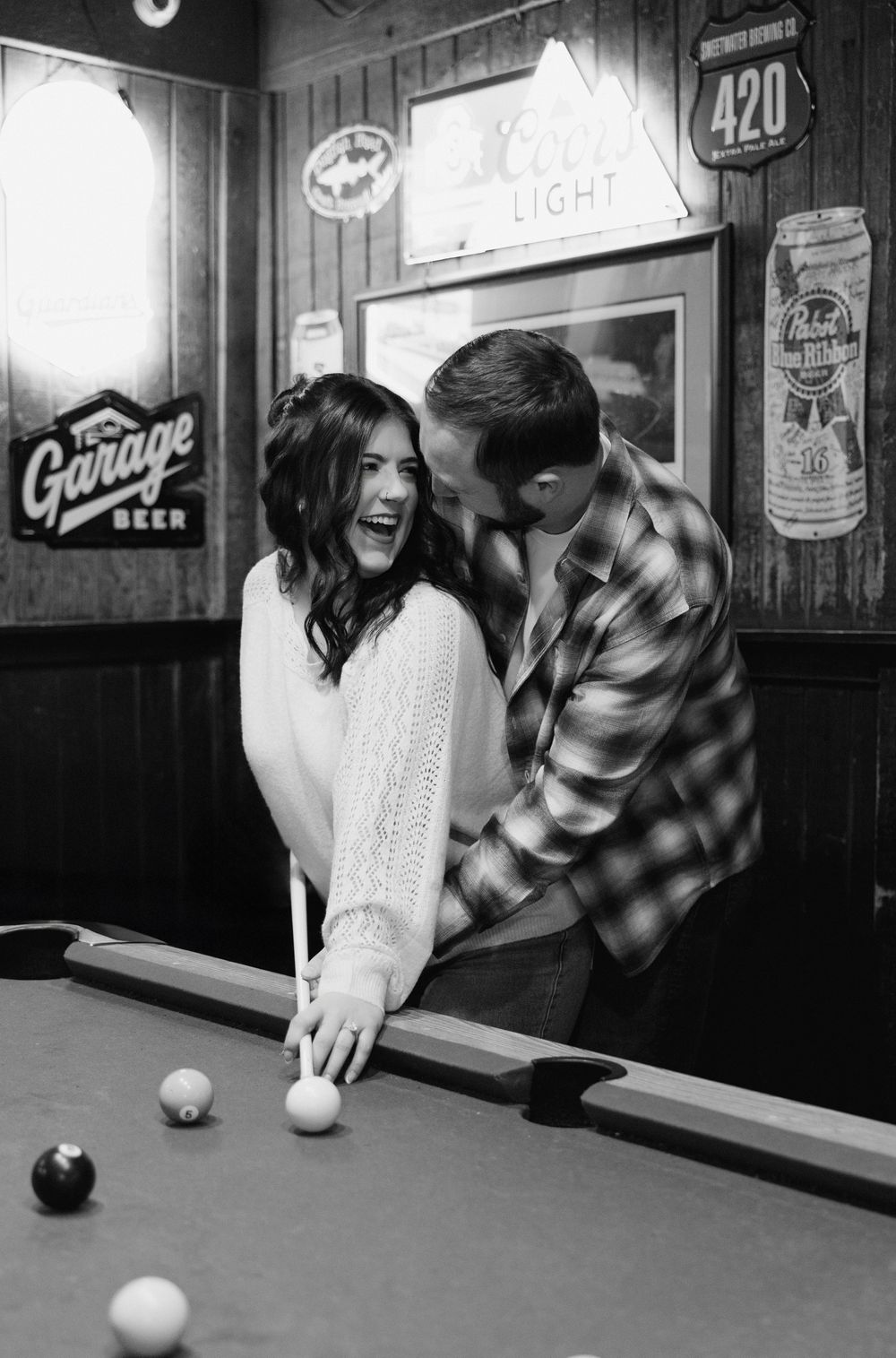 Four sequential black and white photos showing people playing pool in a bar setting with vintage signs on the wall.