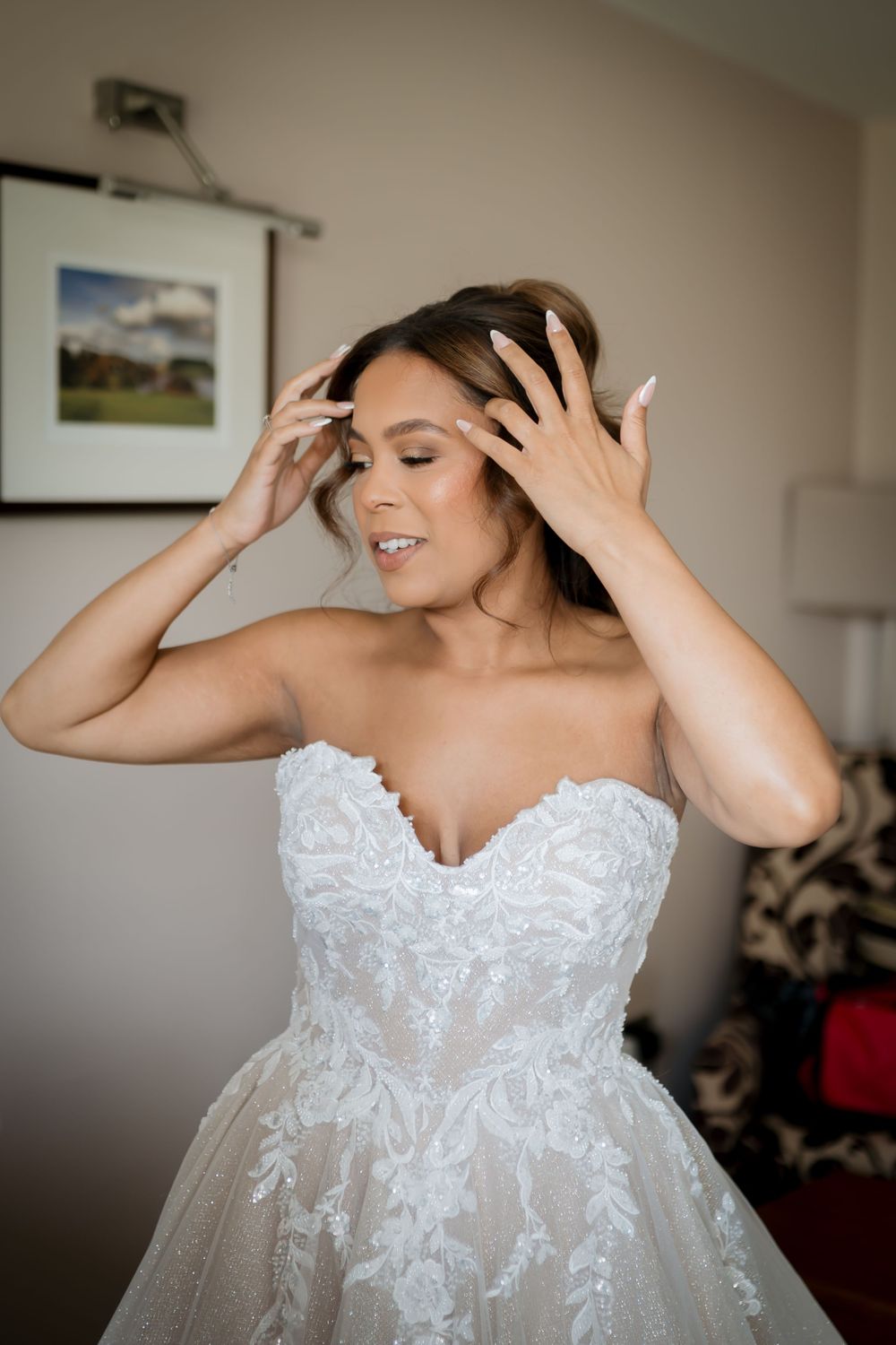 Close-up shots of a bride in a white strapless wedding dress with delicate lace detailing.