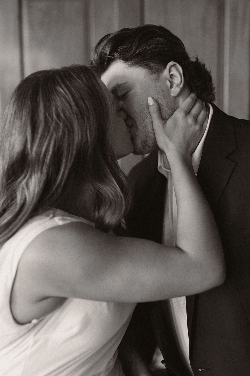 A series of intimate black and white photographs showing a romantic embrace.