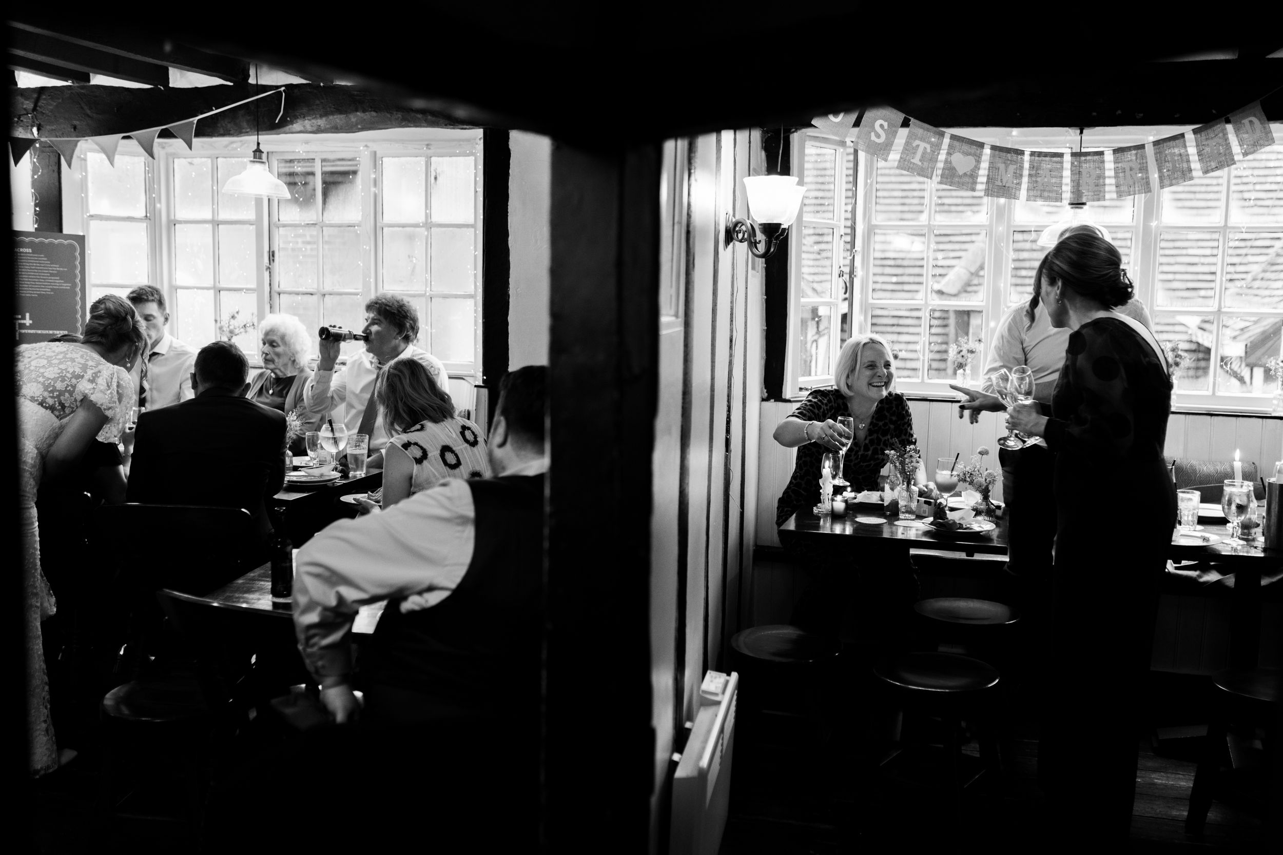 A black and white photo series showing people working in an office space with windows and desk setups.