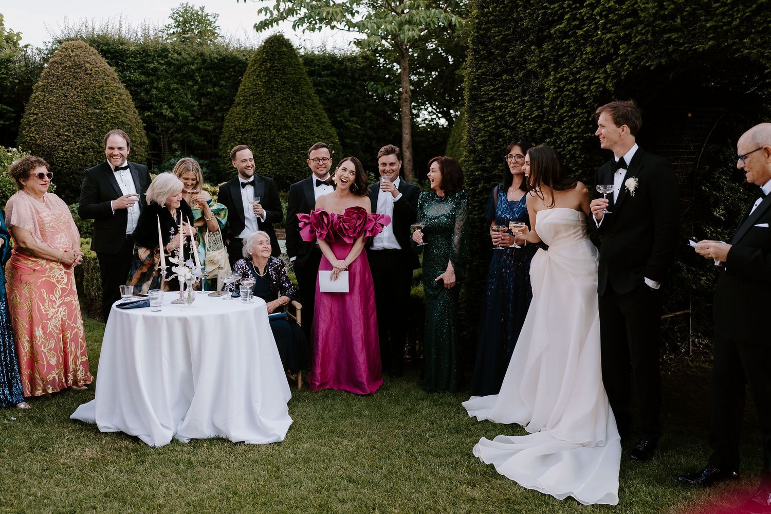 father of bride giving a speech to laughing wedding guests at dewsall court in herefordshire