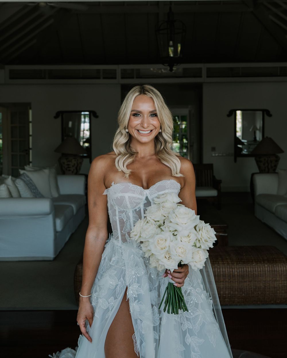 Elegant wedding dress with delicate lace details shown from multiple angles in a bright interior space.