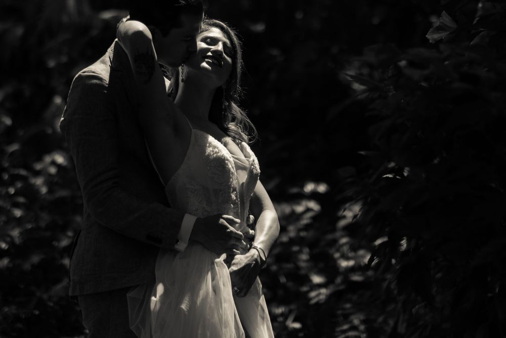 Dramatic black and white portrait of couple embracing.