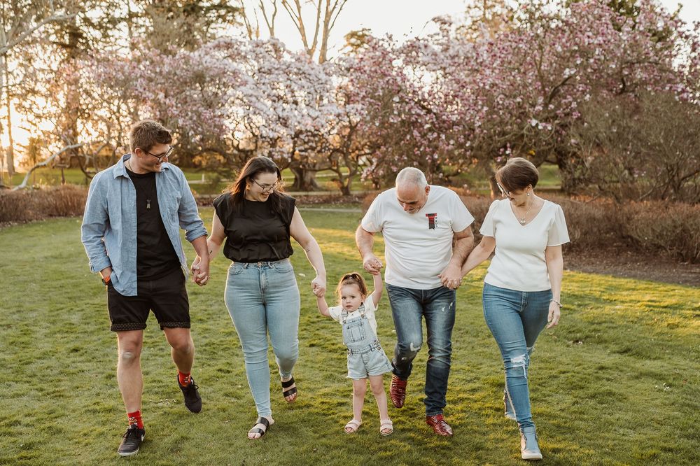 Six casual lifestyle photos of people walking and bonding together in a field during golden hour sunset.