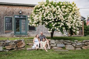 Family gathered on steps for photos at local New Hampshire farm.