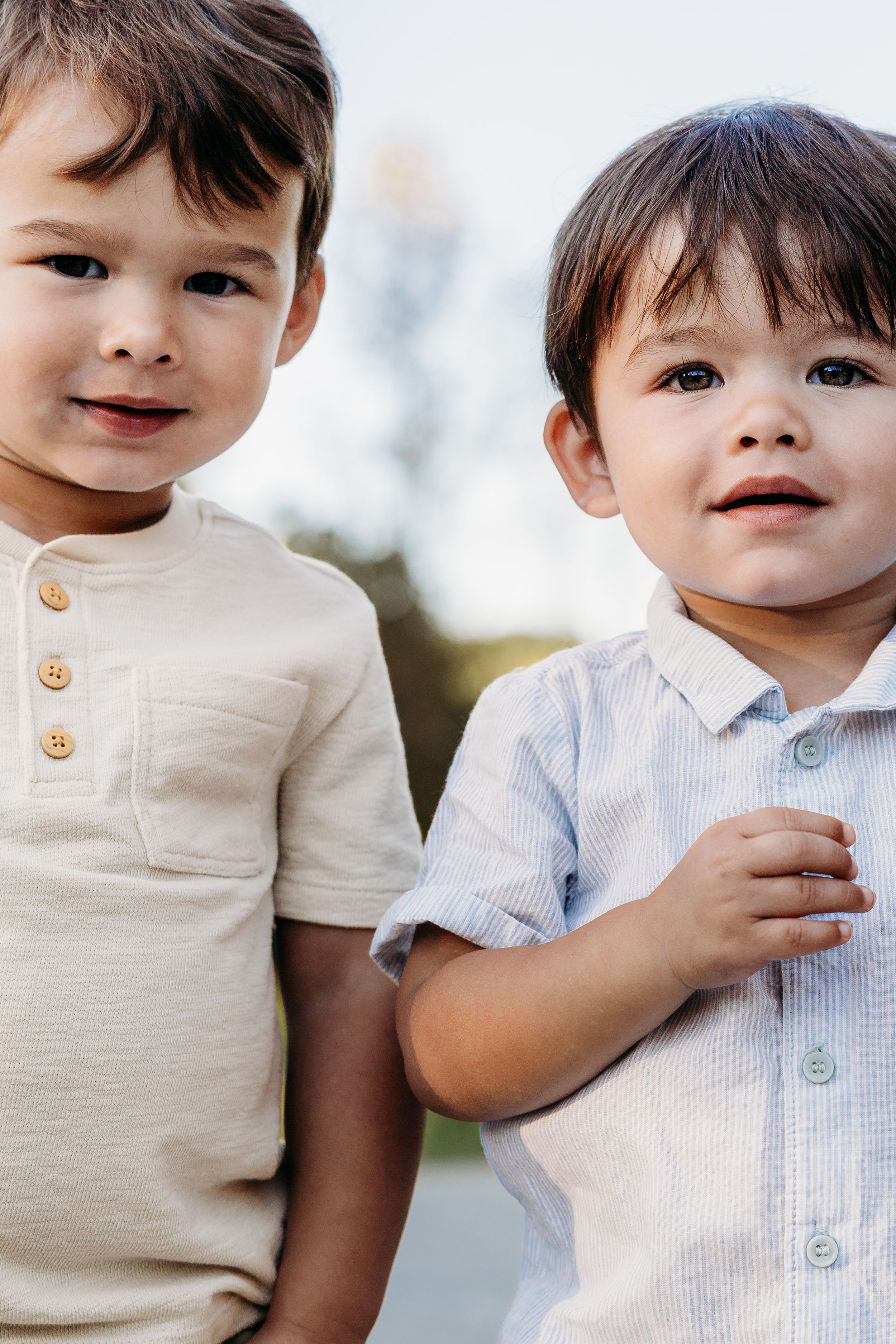 Close-up photo series of a toddler wearing beige and white clothing against a light background.