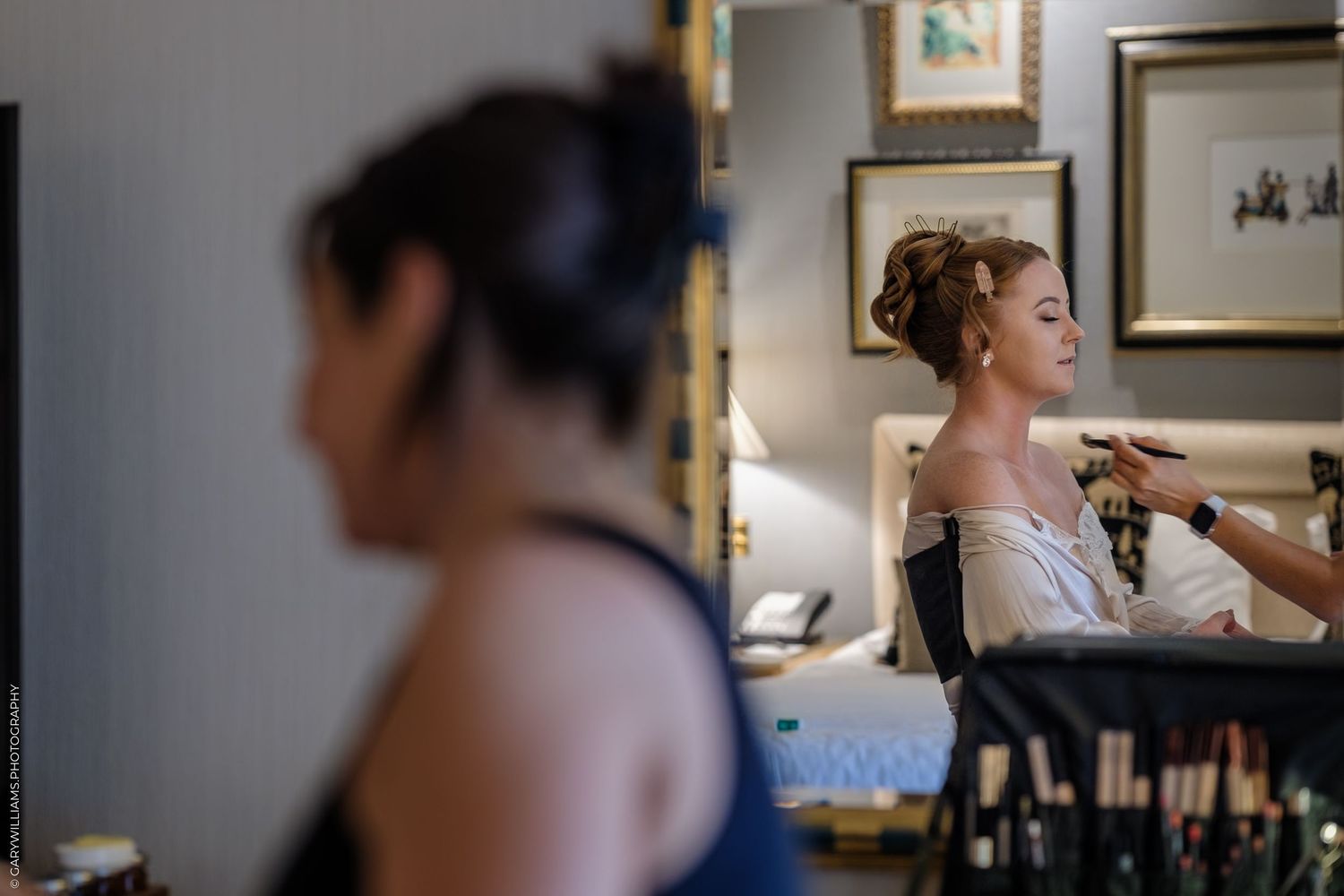 A series of wedding preparation photographs showing makeup application and styling in a softly lit room.