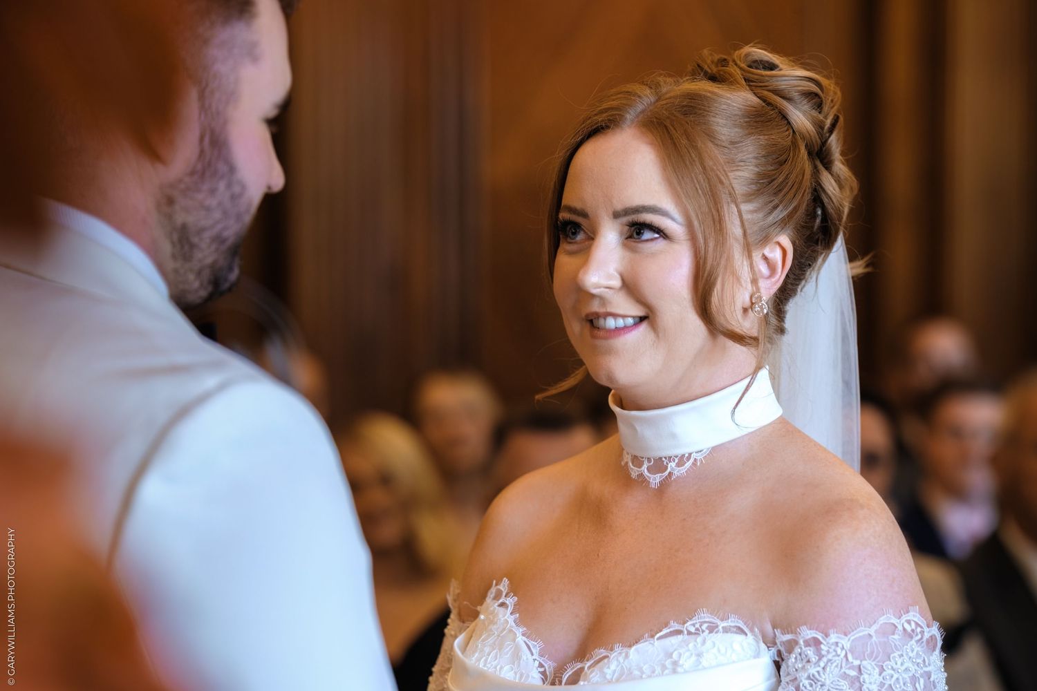 A romantic wedding couple embraces on a dance floor during their special day celebration.