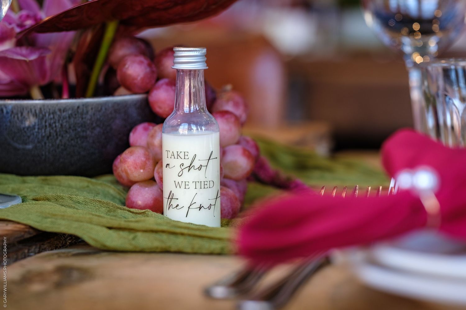 Closeup photos of glass jars with handwritten labels in pink and brown tones form a decorative collage.