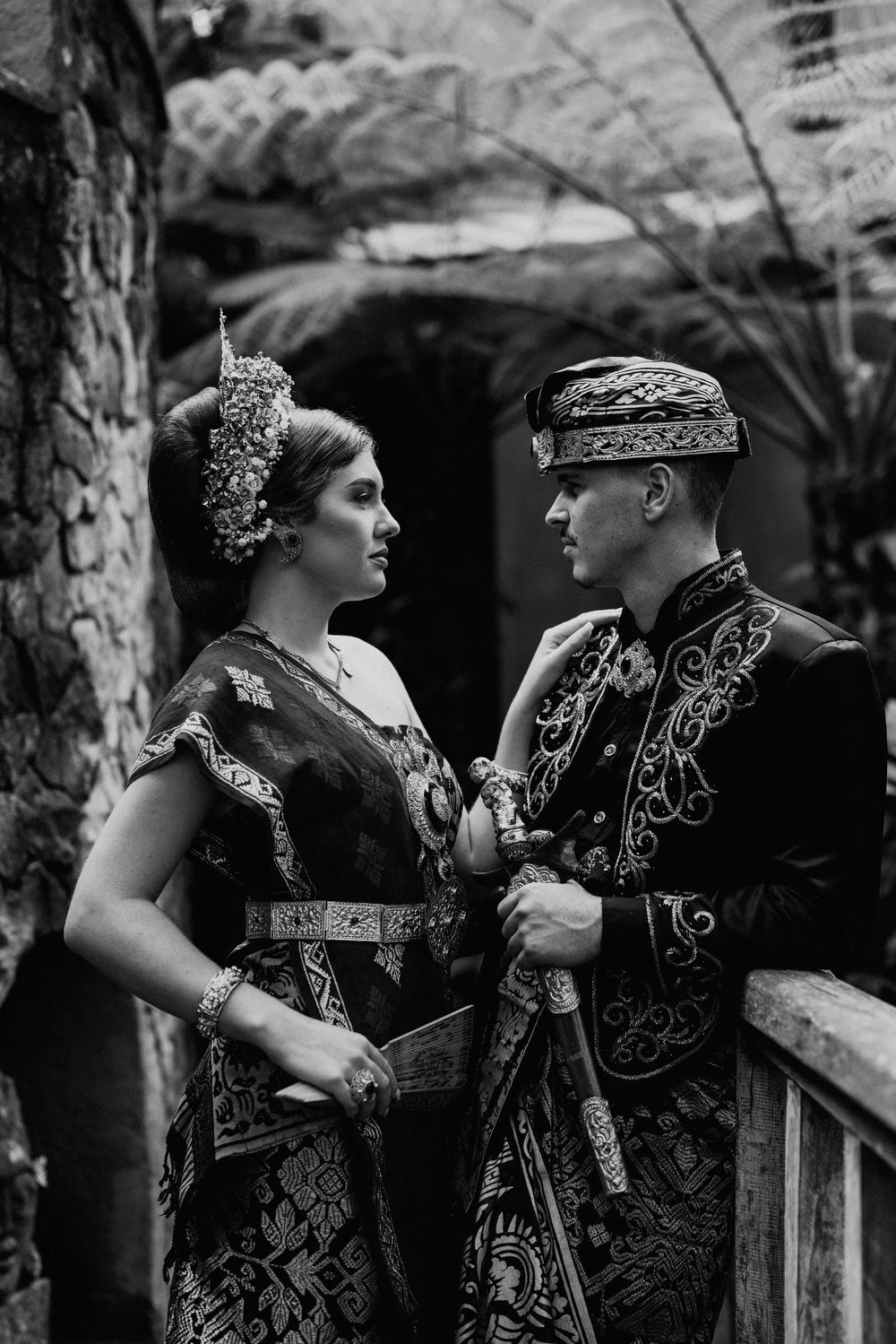 Black and white portrait series of couple in ornate traditional Indonesian wedding attire.