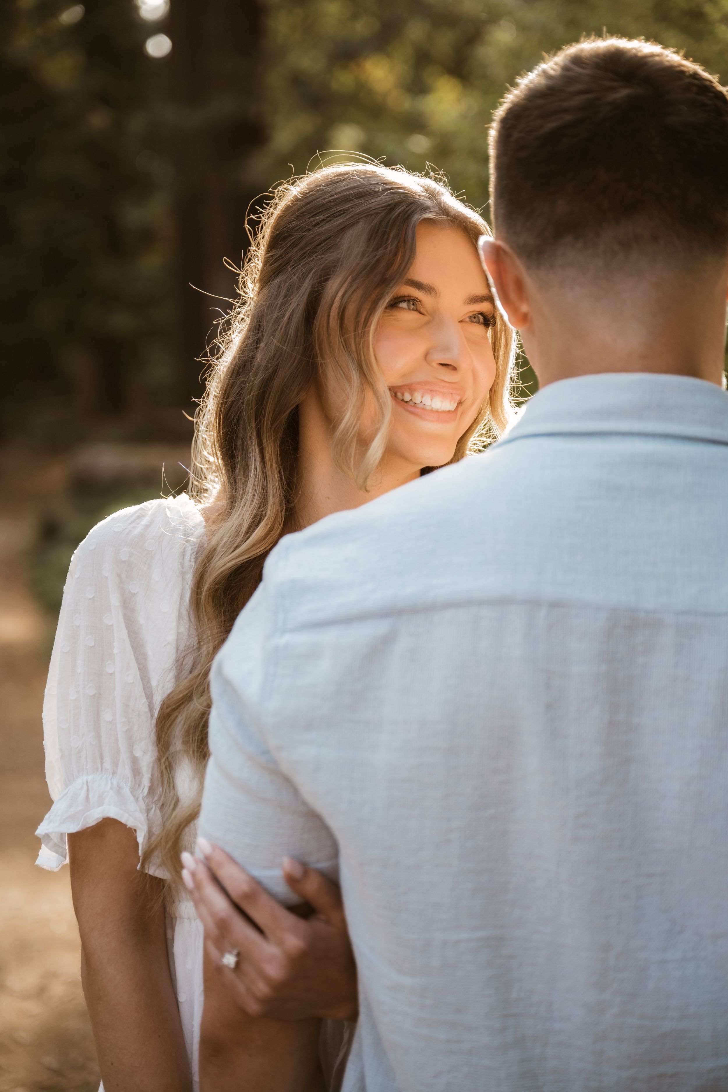 Close-up shots of a couple sharing intimate moments in natural sunlight.