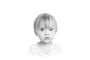 Close-up portrait drawing in soft monochrome tones.