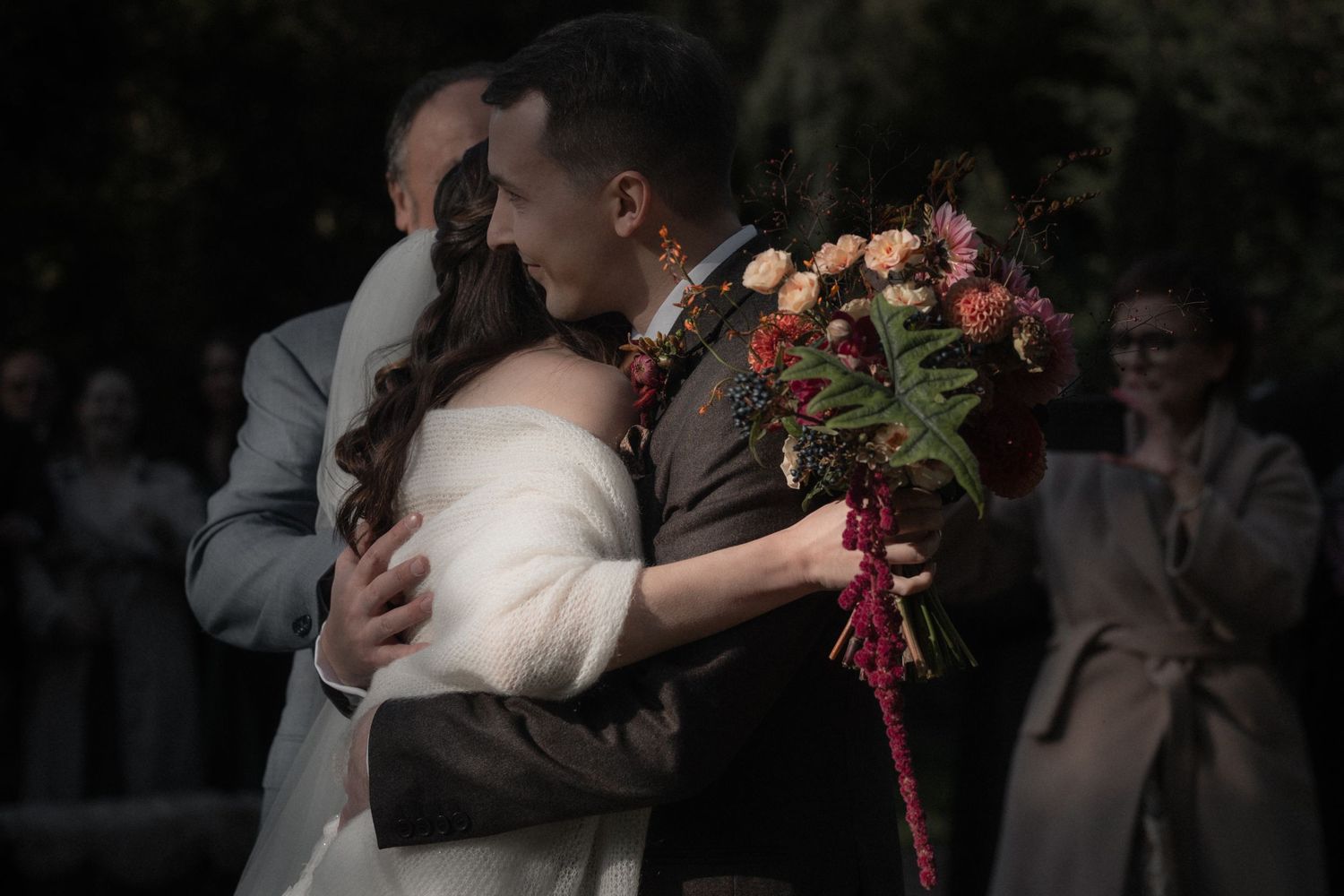 A sequence of romantic wedding moments showing couples embracing and dancing during their celebration.