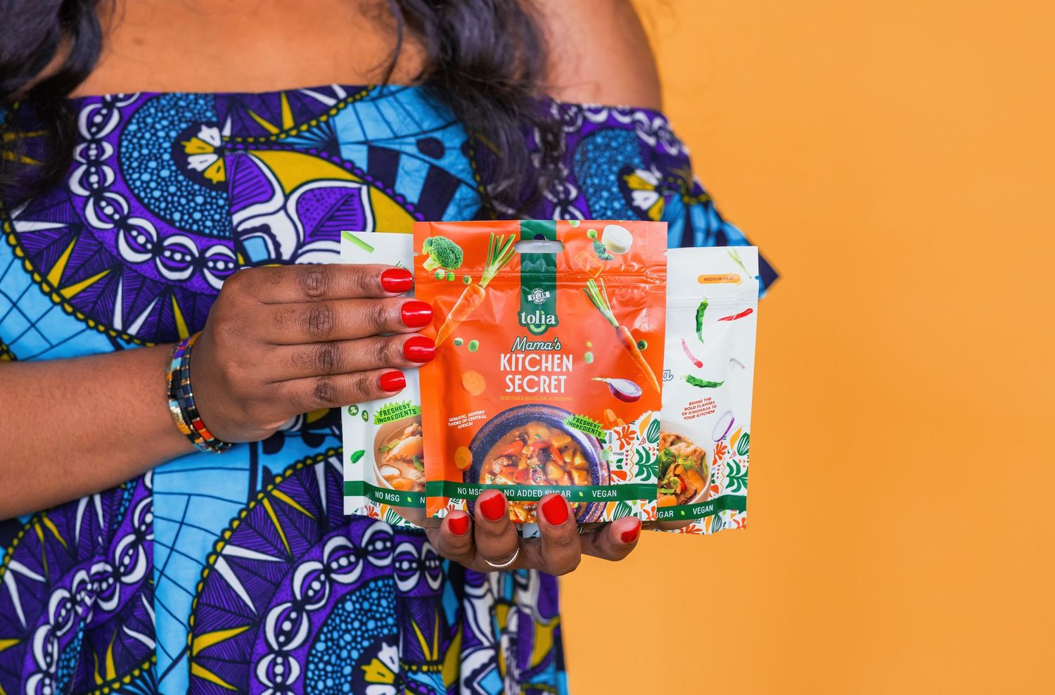 Colorful product display featuring snack boxes against orange background.