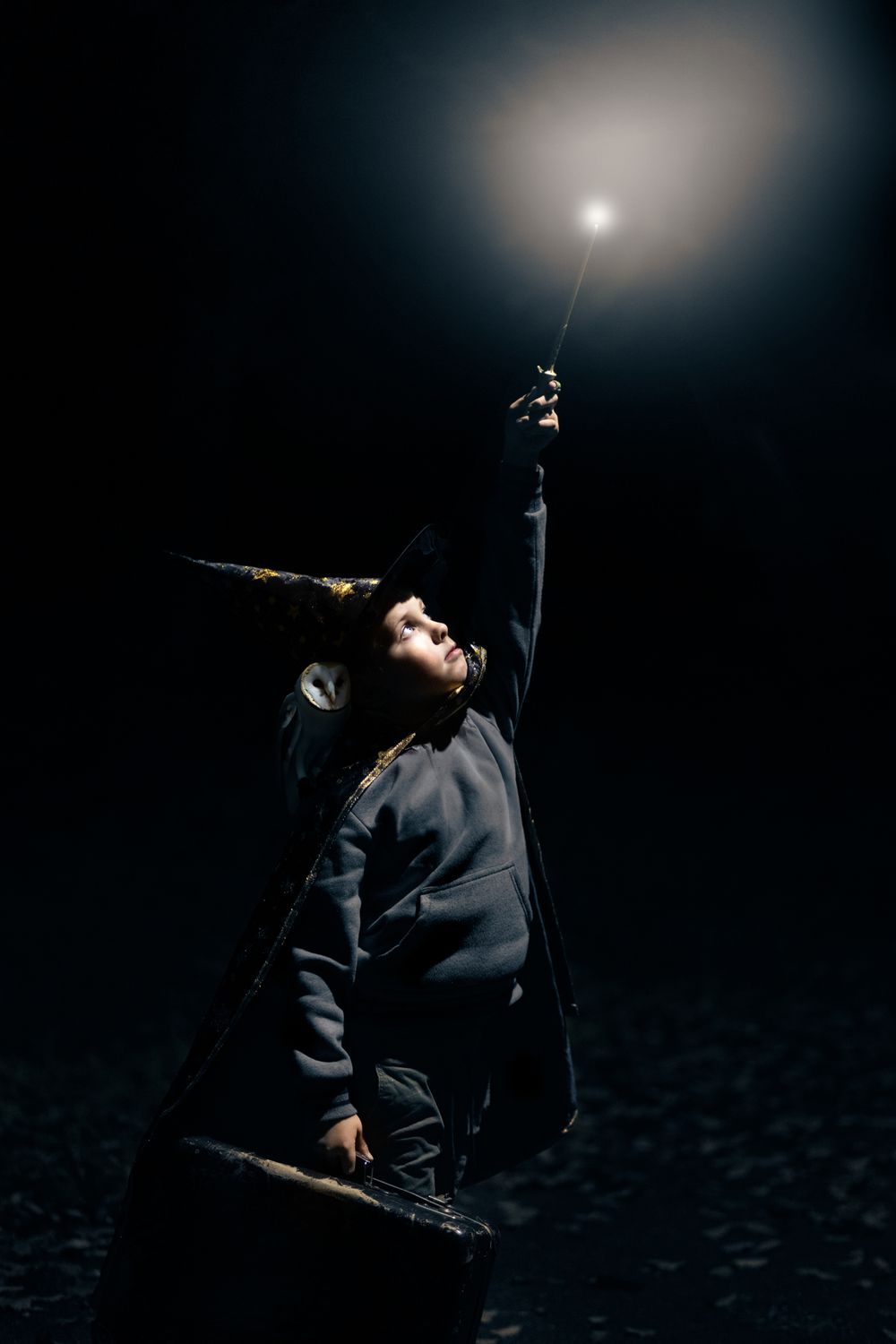 A dramatic sequence of silhouetted figures against a dark background with a bright light source creating atmospheric effects.