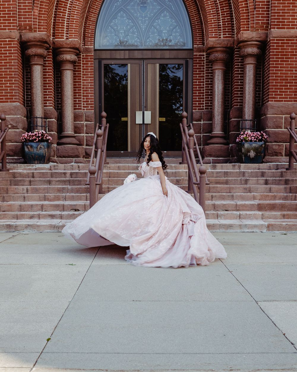A flowing pink wedding dress train spreads elegantly across church steps in a series of artistic photos.