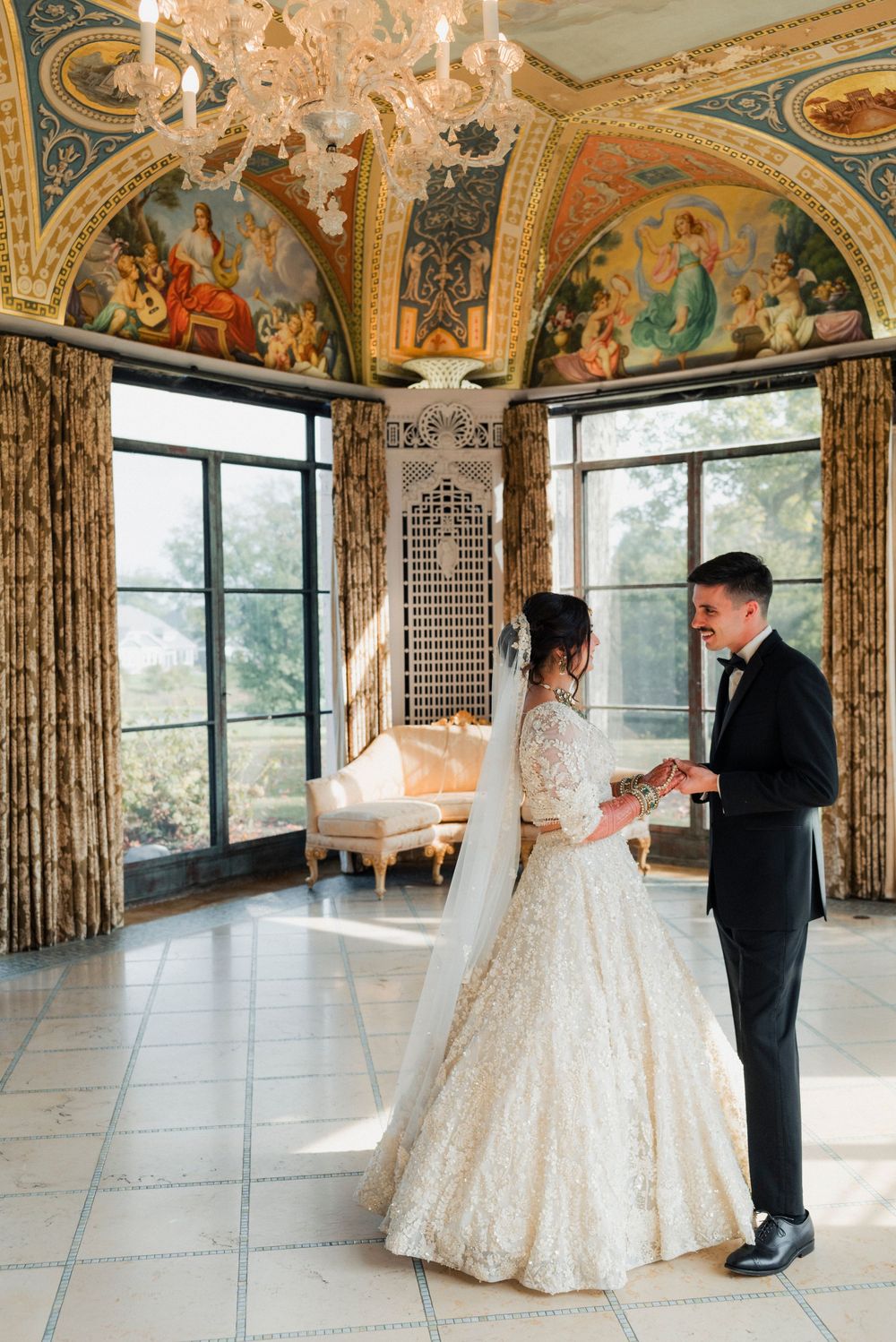 A bride and groom during their first look in the Cuneo Mansion's Formal Dining room.