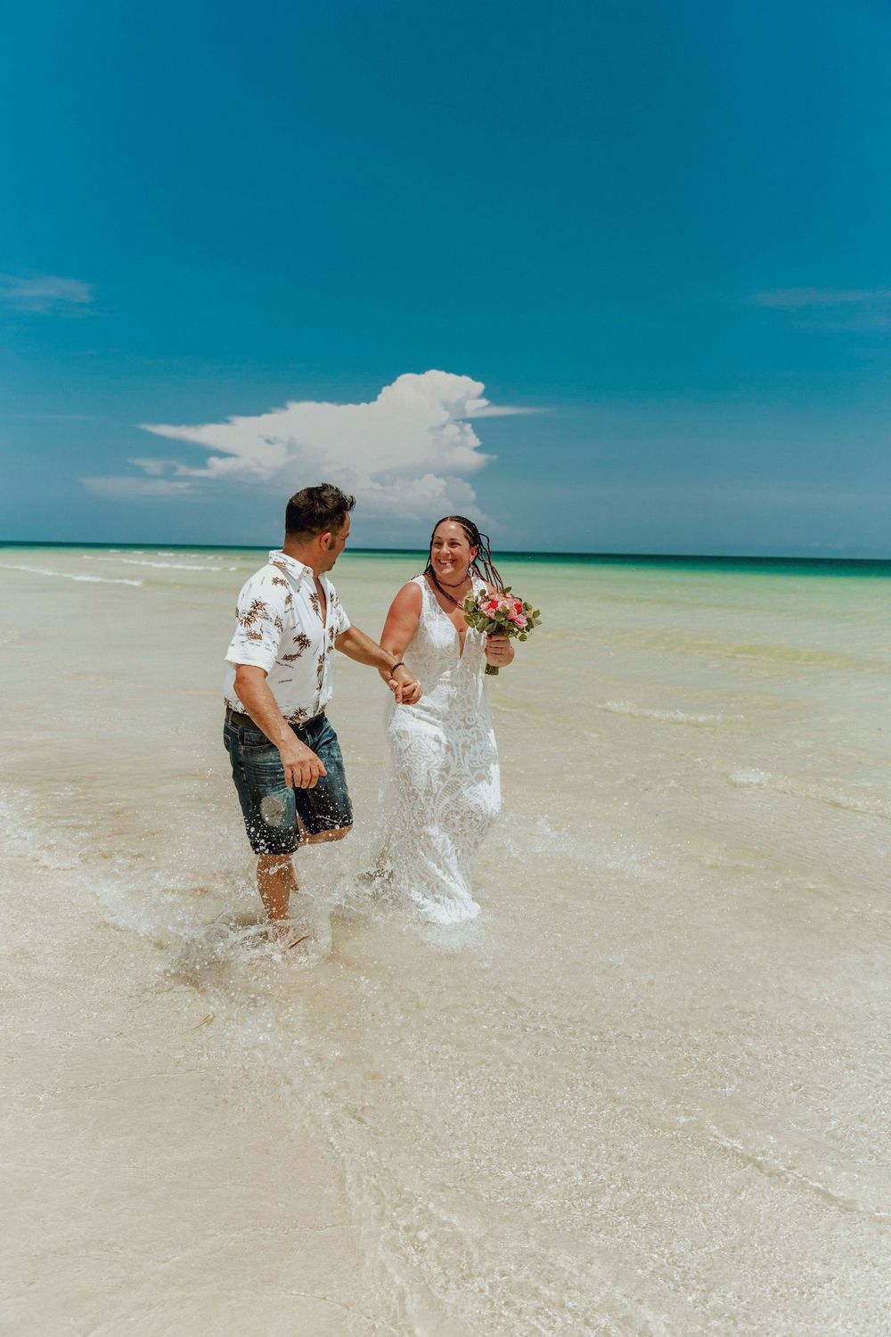 Couple celebrating engagement Zanzibar beach