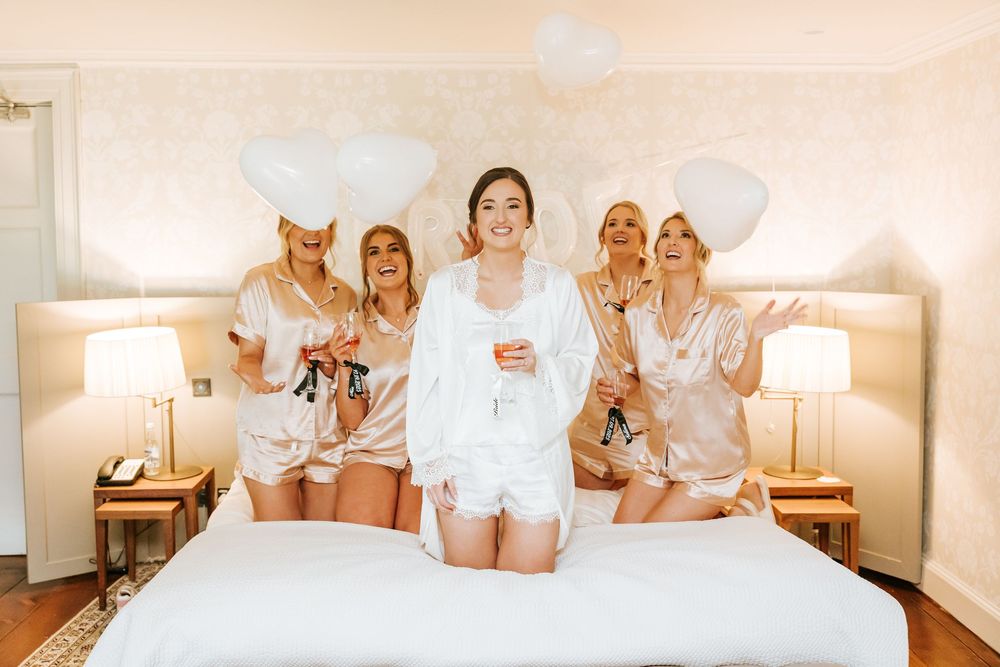Group of people in white robes relaxing and enjoying spa treatments in a luxurious wellness setting. Farnham estate