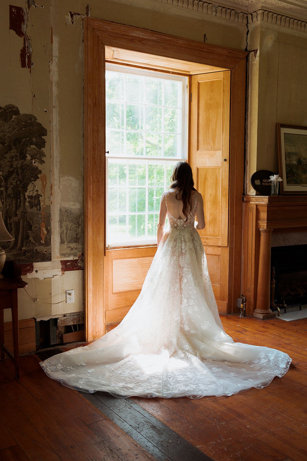 Sequence of wedding dress shots in sunlit room showing flowing train and details.